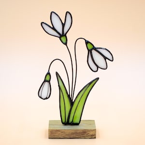 Small Stained Glass Suncatcher Plant Snowdrop Flower on a Wooden Stand